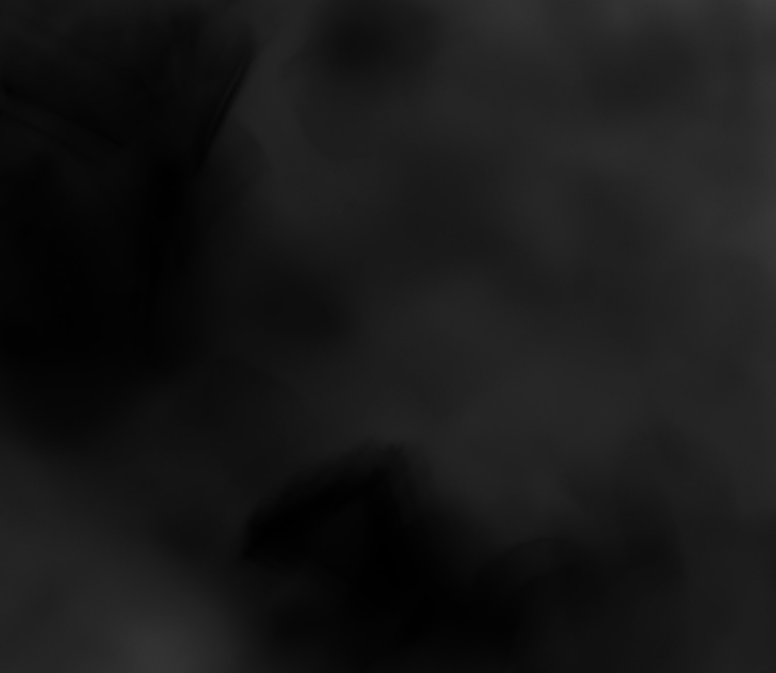 Abstract dark texture or background with shadows.