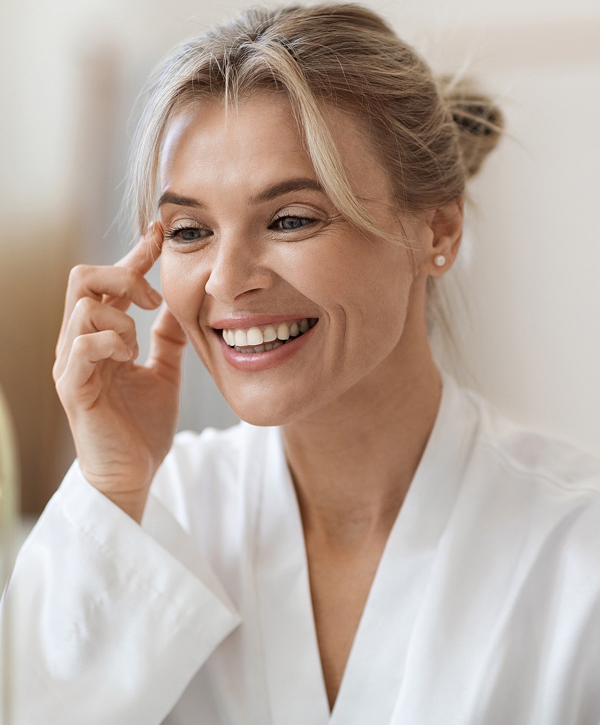 Close-up of a woman's face and smile.