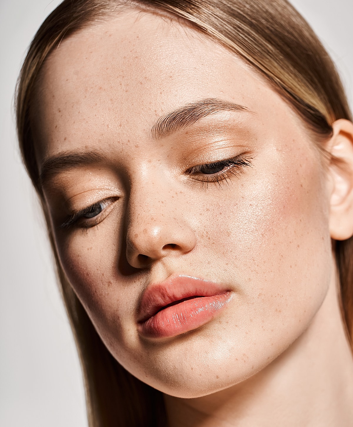 Close-up of a woman's face and smile.