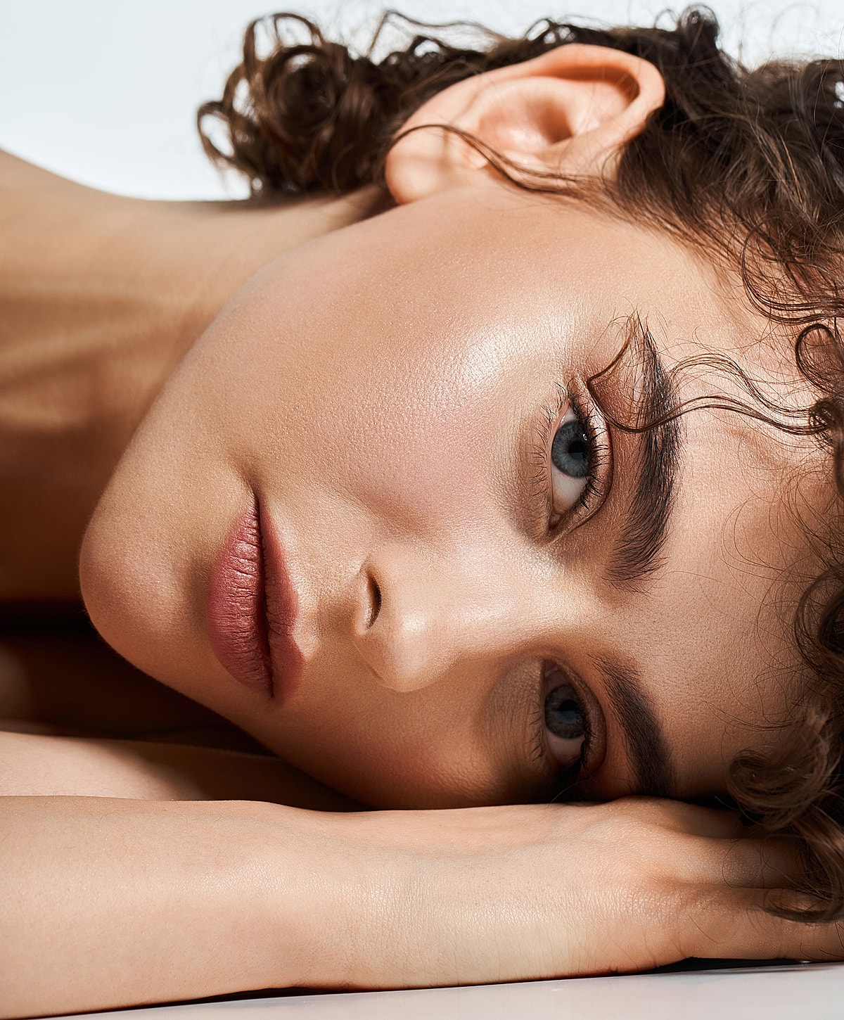 Close-up of a woman's face and smile.