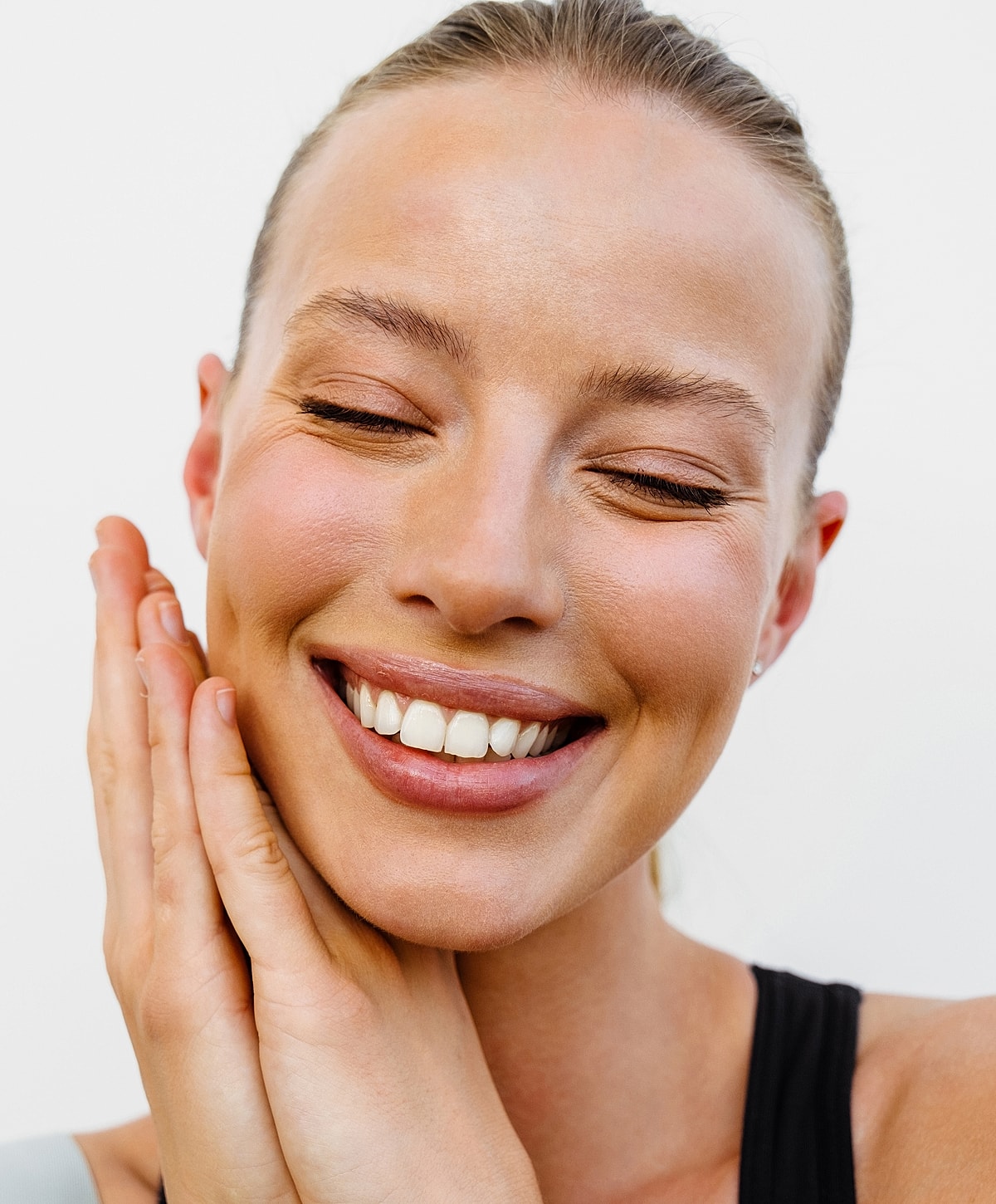 Close-up of a woman's face and smile.