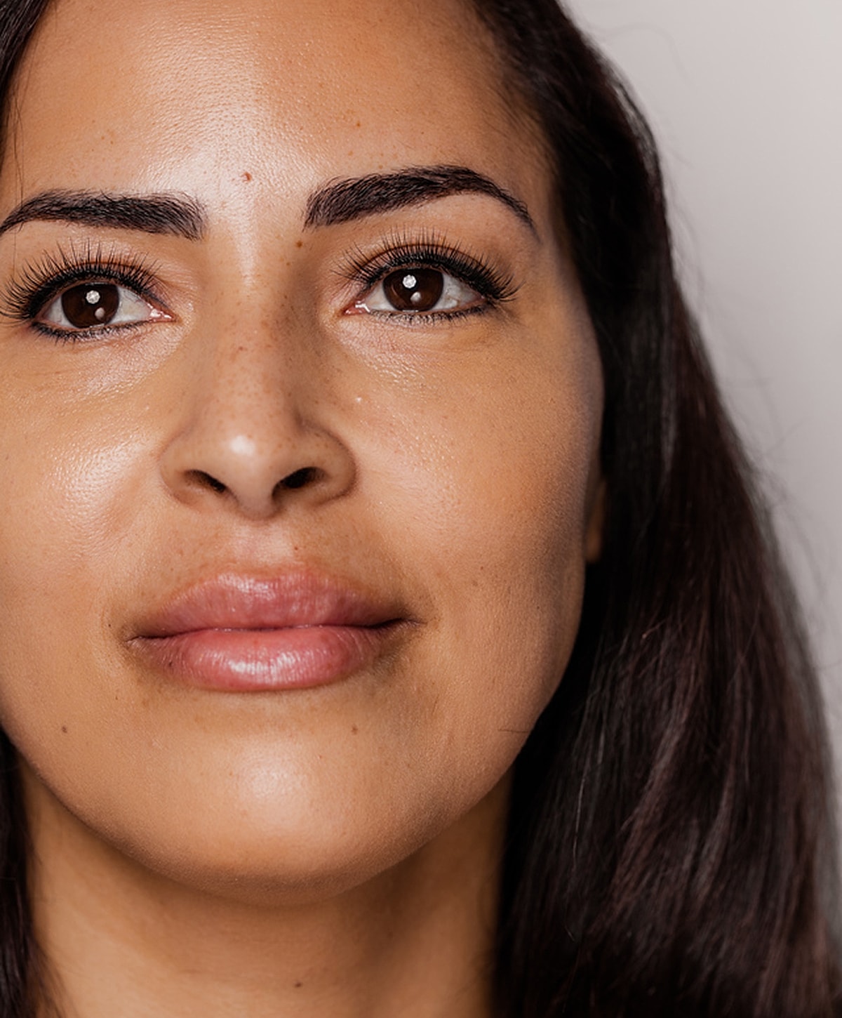 Close-up of a woman's face and smile.
