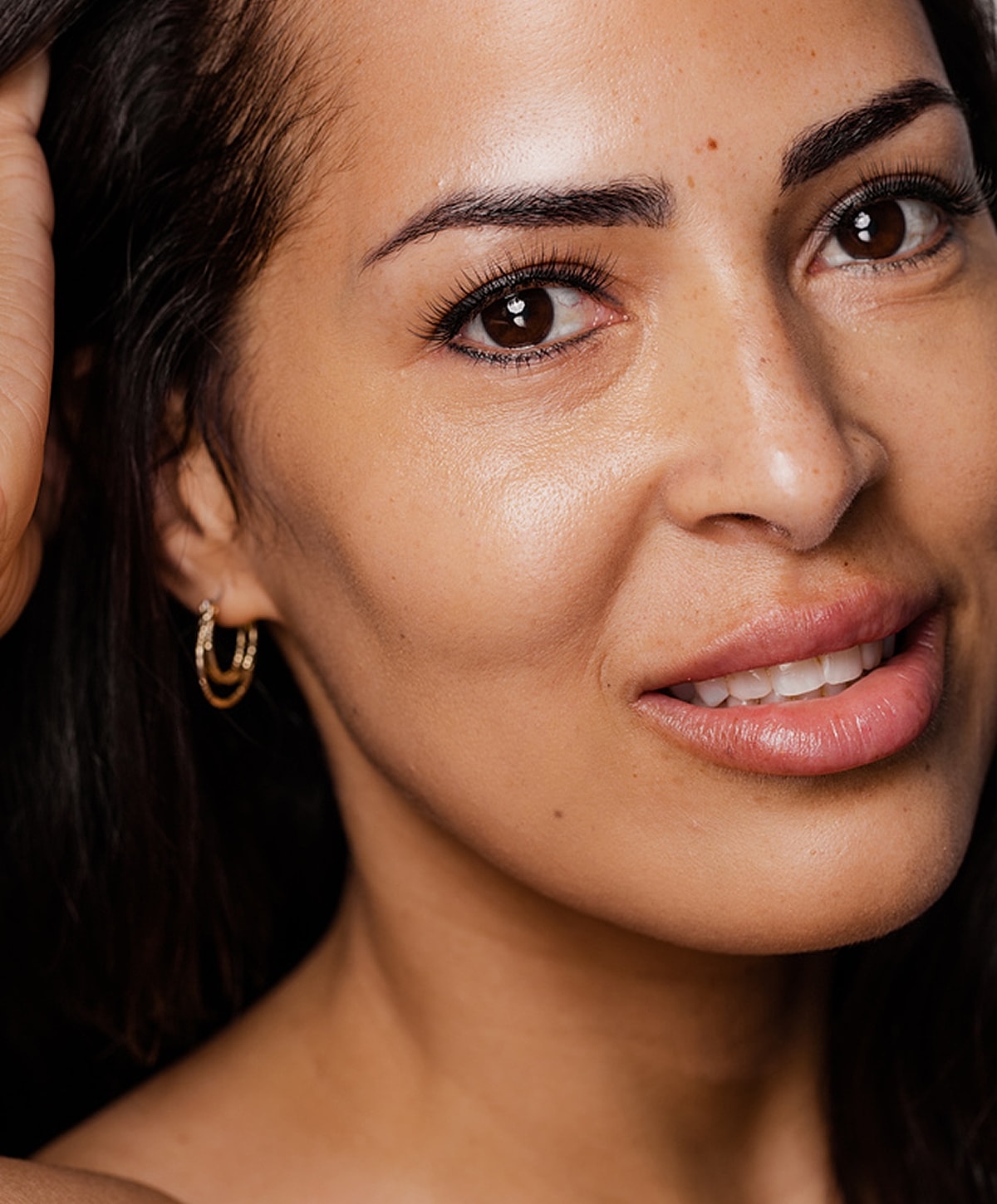 Close-up of a woman's face and smile.