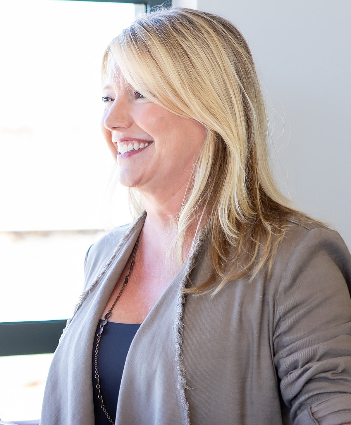 Close-up of a woman's face and smile.