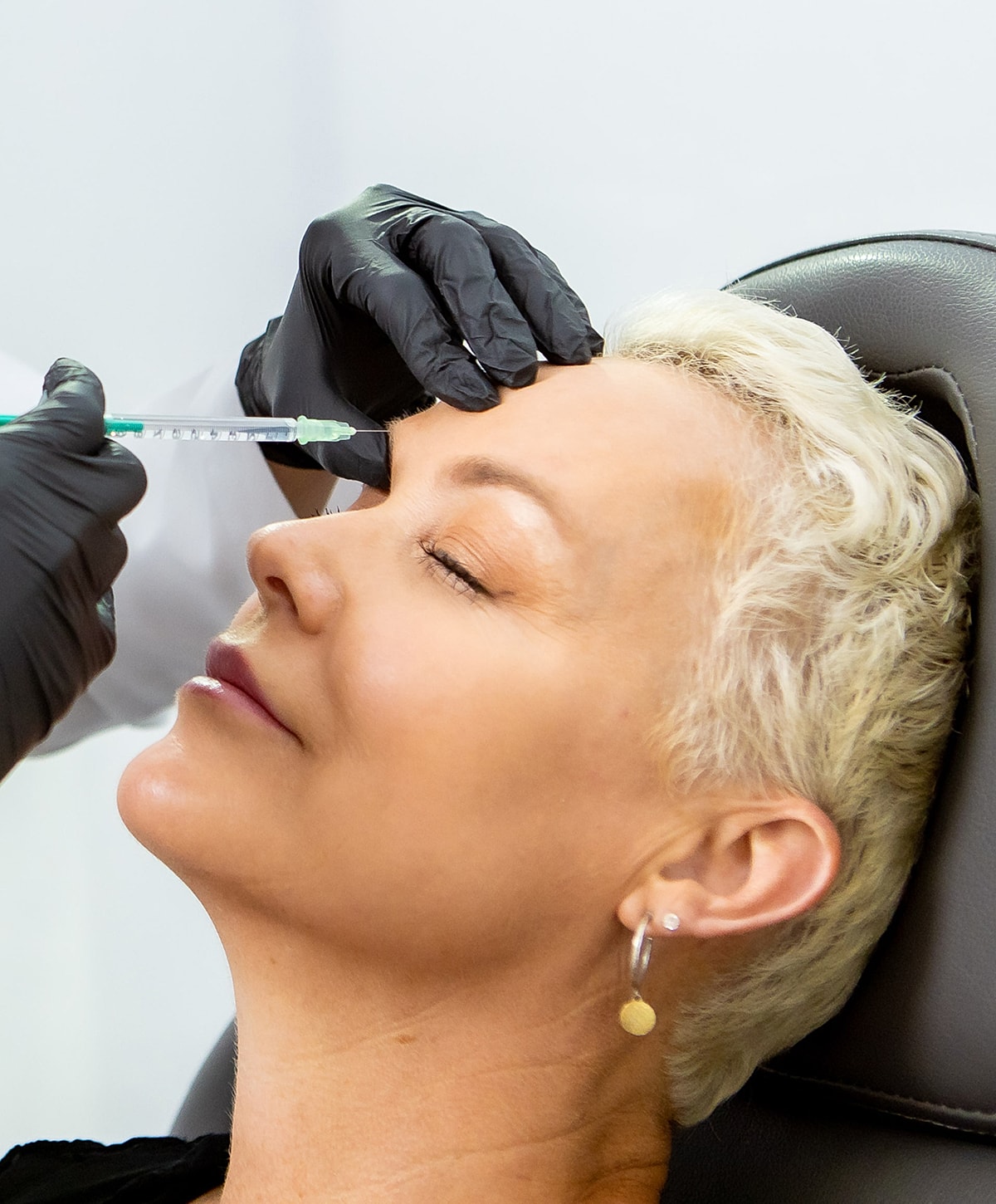 Close-up of a woman's face and smile.