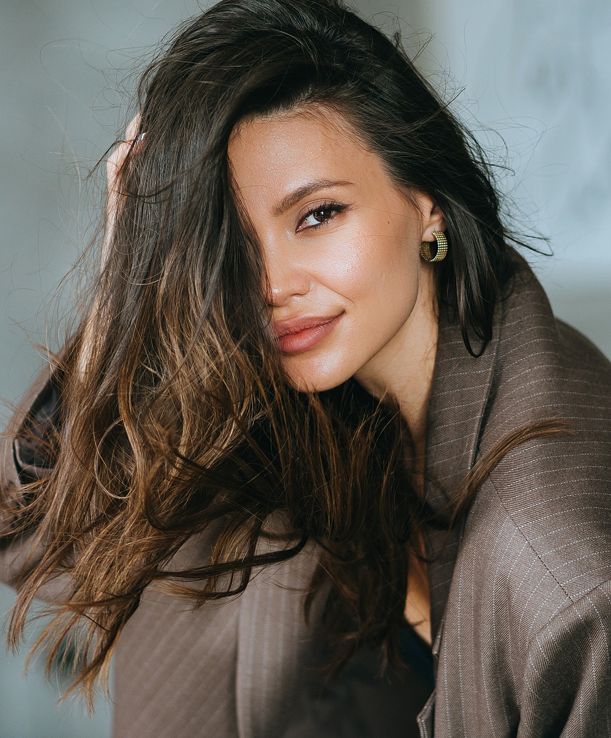 Close-up of a woman's face and smile.