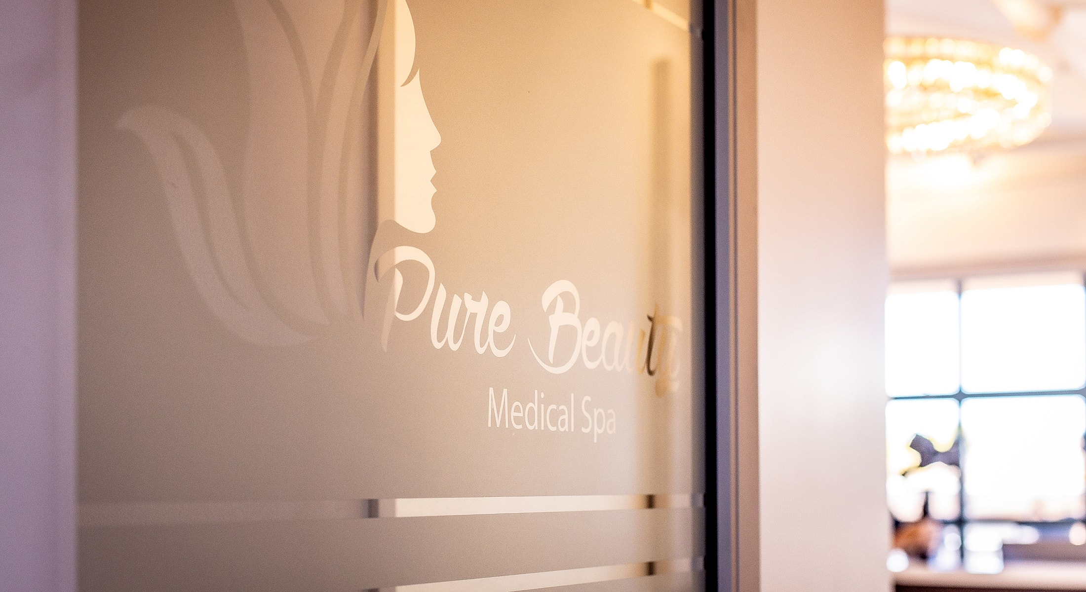 Pure Beauty Medical Spa logo on window.