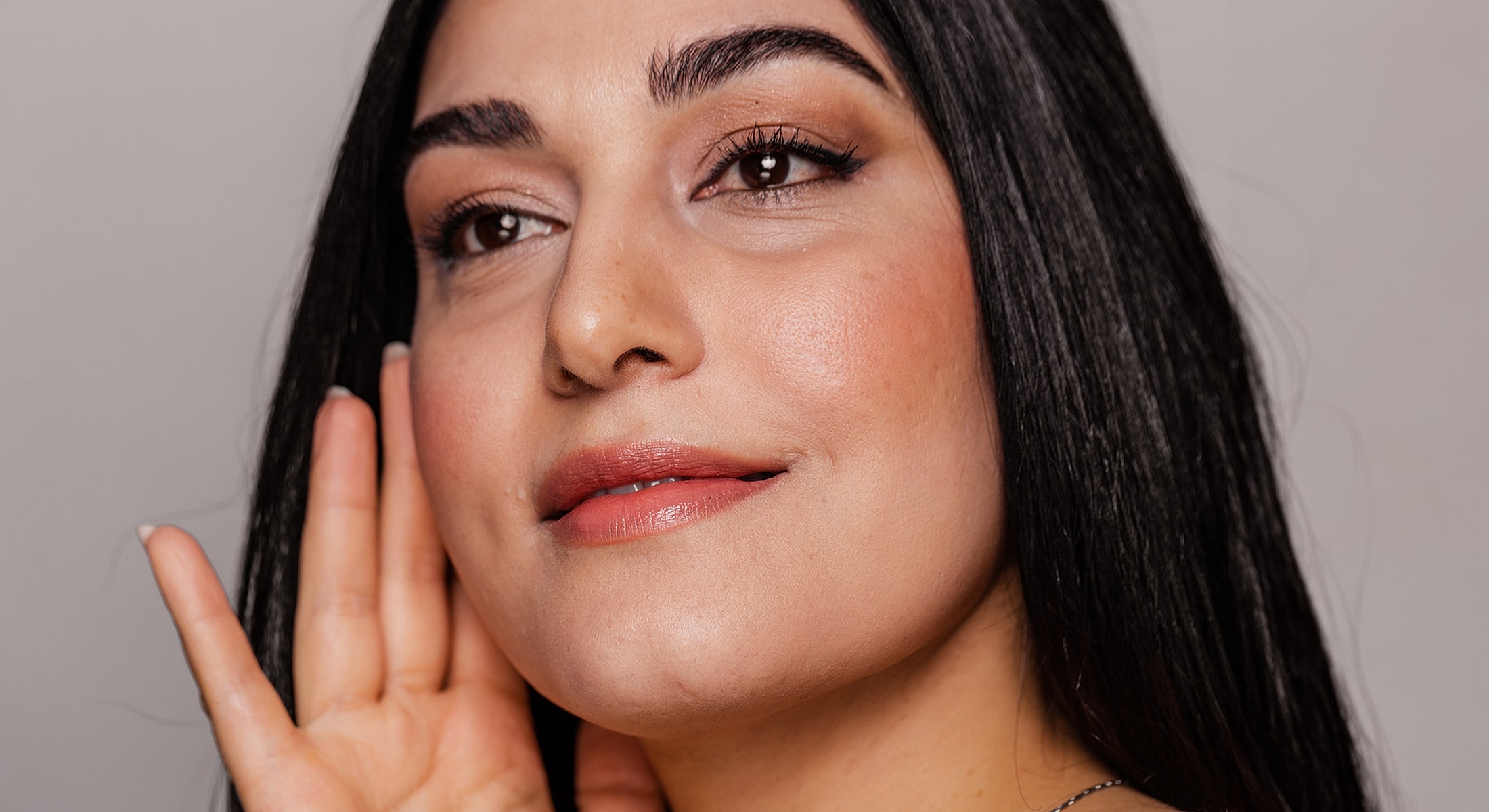 Woman with long hair listening attentively.